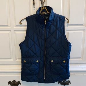 Francesca’s winter puff vest, in Navy Blue.